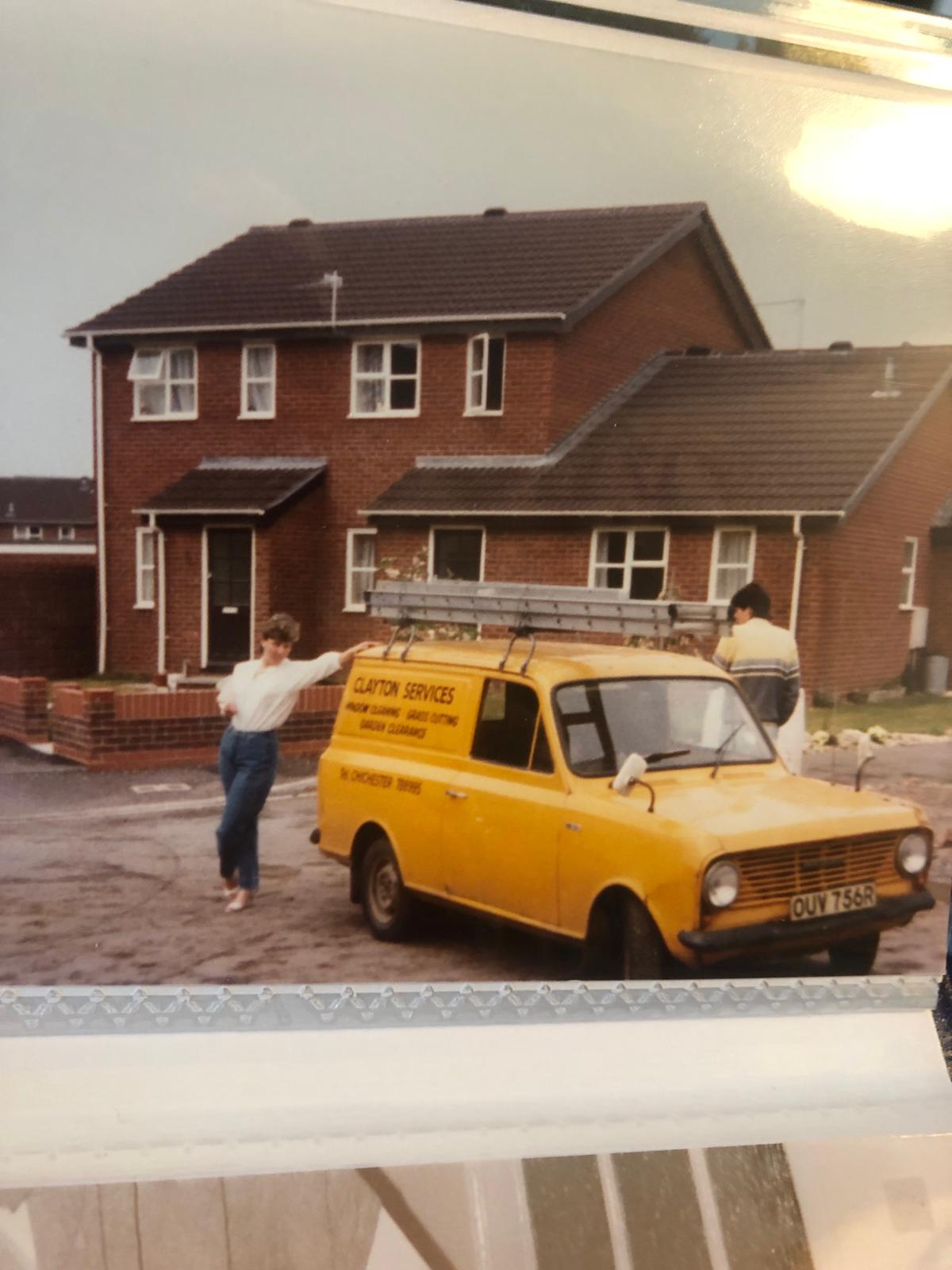 Tim and his wife beside his first window cleaning van in the 1980s